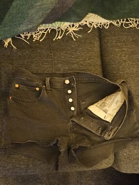 Levi's black denim with tan leather patch